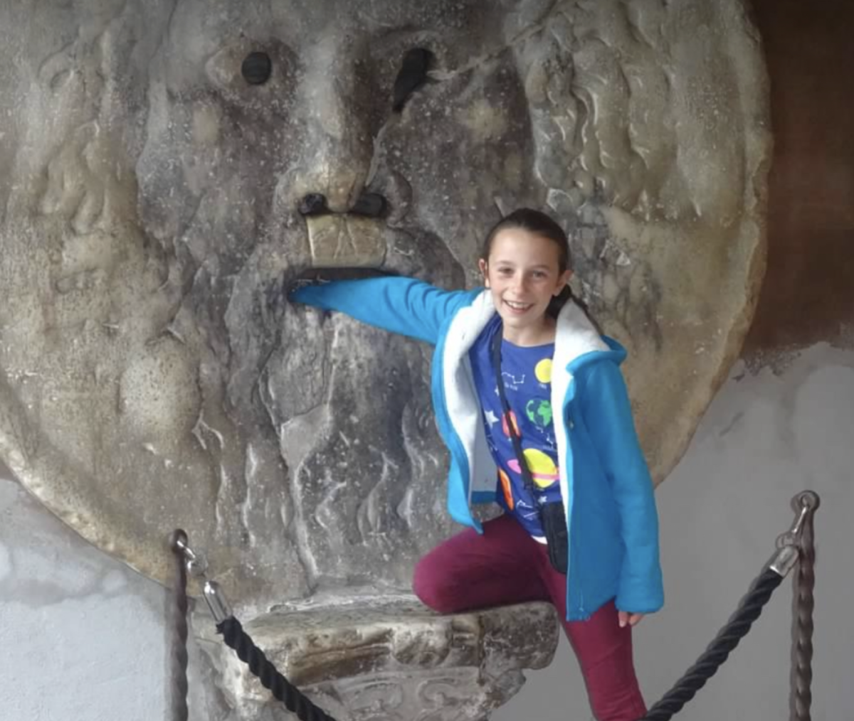 Lynch’s well-rounded personality as a student can be attributed to her worldly knowledge. Making trips with her family all throughout Europe. Depicted is young Lynch sticking her hand in the Bocca della Verità, also known as the Mouth of Truth, located in Cosemdin church in Rome. 
